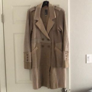 Beige colored below the knee cardigan.